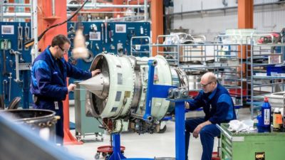 GKN - 2 male engineers working on plane engine