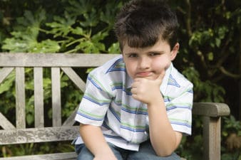 Boy sitting thinking
