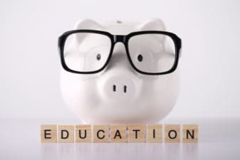 Education Concept Piggy Bank with glasses