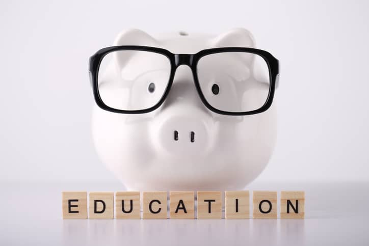 Education Concept Piggy Bank with glasses