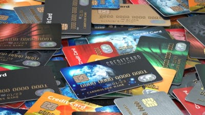 Pile of colored credit cards background,