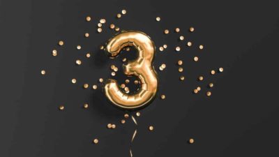 Number 3 flying foil balloon and gold confetti