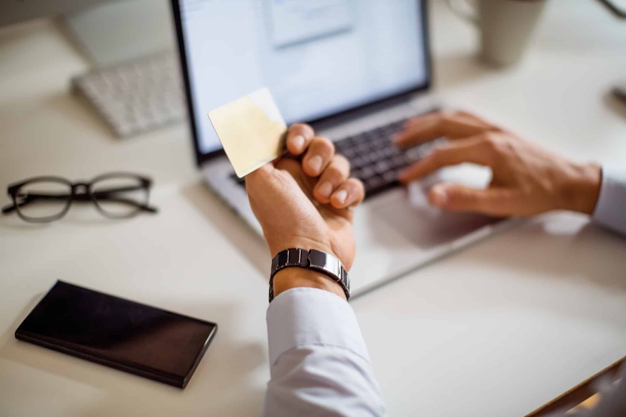 Man using credit card for online shopping