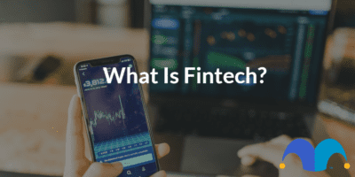 Computer and phone showing charts with the text “what is fintech?” and The Motley Fool jester cap logo