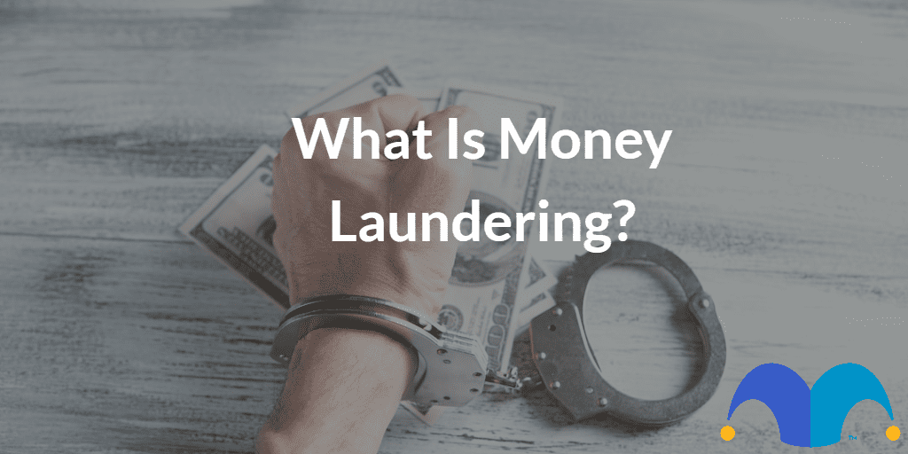 Hand with cuffs on with the text “What Is Money Laundering?” and The Motley Fool jester cap logo