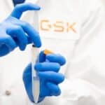 GSK scientist holding lab syringe