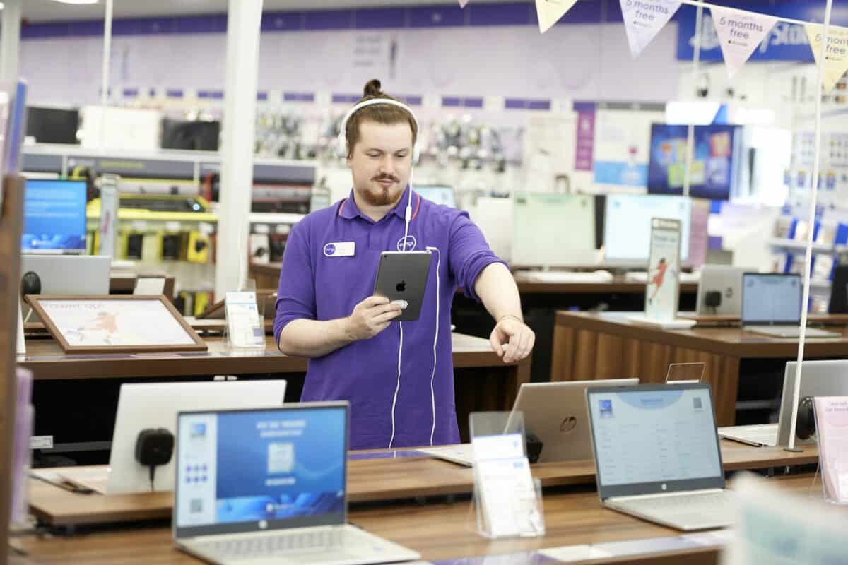 A Currys sales advisor on the shop floor.