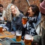 Group of friends meet up in a pub