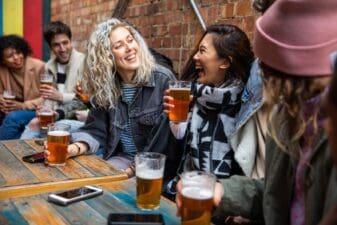 Group of friends meet up in a pub