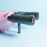 piggy bank, searching with binoculars