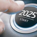 Finger pressing a car ignition button with the text 2025 start.